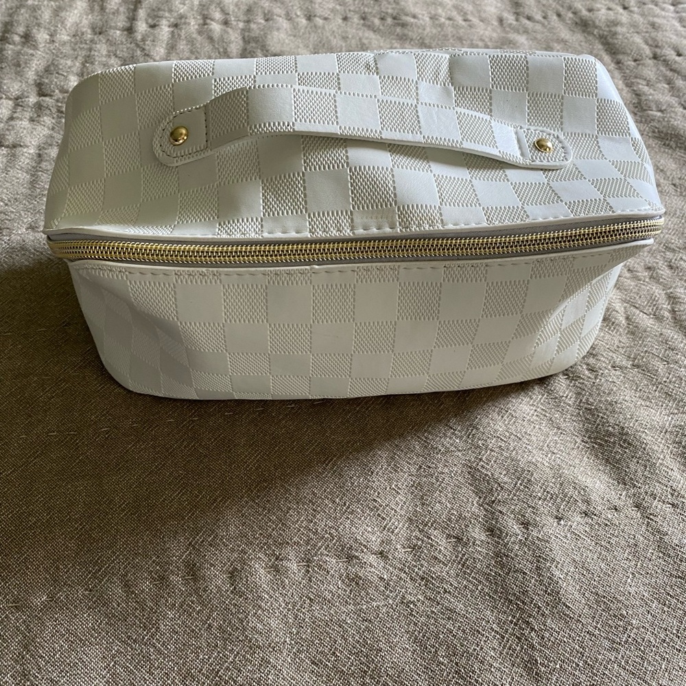 Super cute off white/cream color makeup travel tote zips close